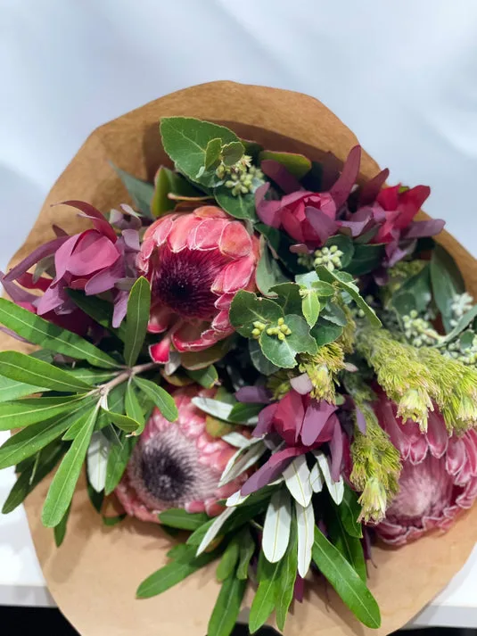 Native protea and eucalyptus bouquet in kraft paper